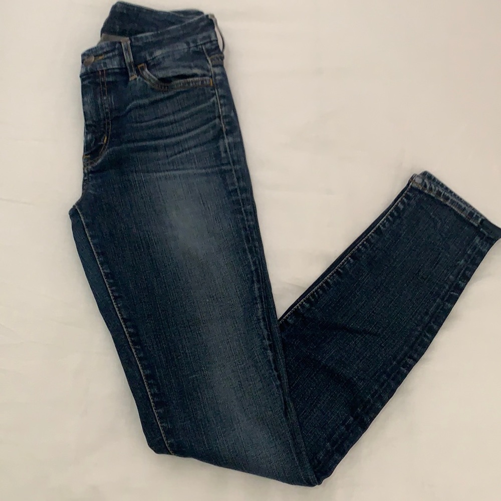 Koral brand distressed skinny jeans indigo wash.